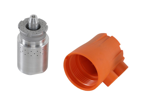 Boquilla metálica de dosificación diseñada para impregnar con grasa el interior de piezas como la mostrada en color naranja